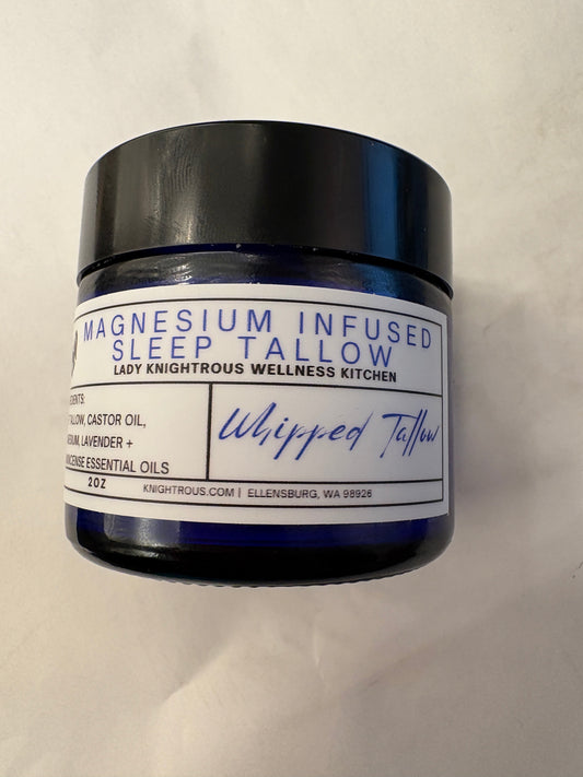 Jar of magnesium-infused tallow on a white background